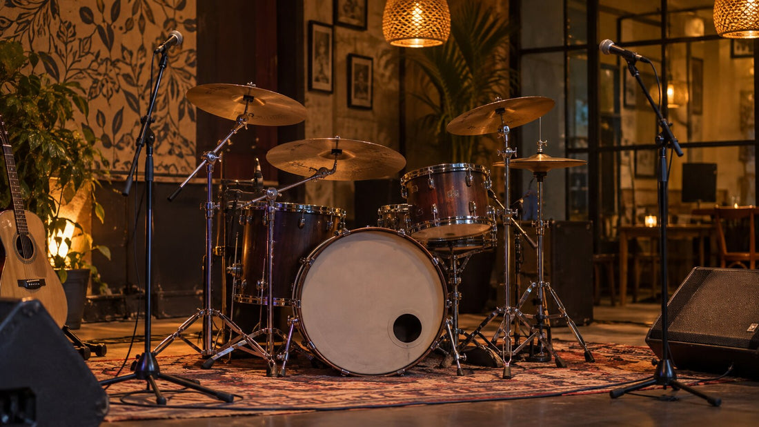 Acoustic drum kit with cymbals set up on a cafe stage in Pune, available on rent
